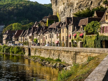 A village in the Perigord Noir region built under a limestone overhang on the edge of the Dordogne river